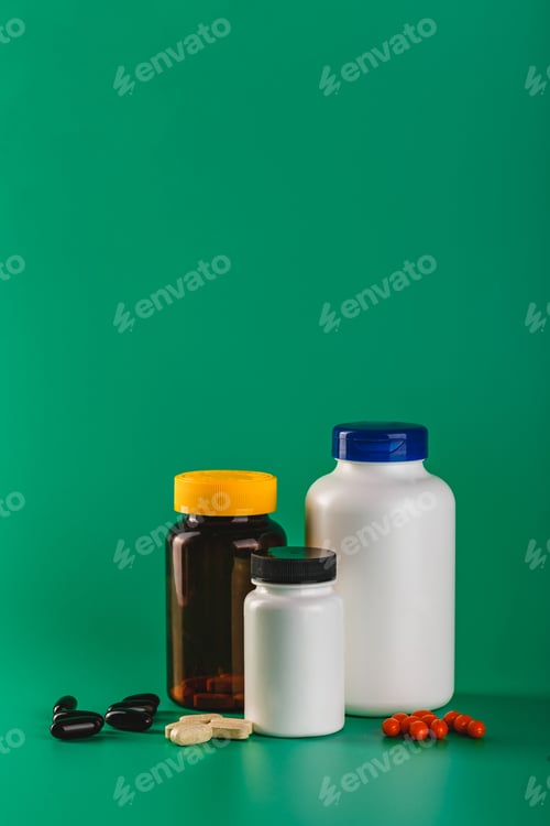 Preview: Bottle and Pills On green Background. Medicine Healthcare Pharmacy Concept. Coronavirus.
