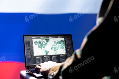 Preview: Hacker at Computer with a World Map