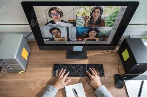 Preview: Top view of Asian Business man hand working with teamwork colleague in video conference