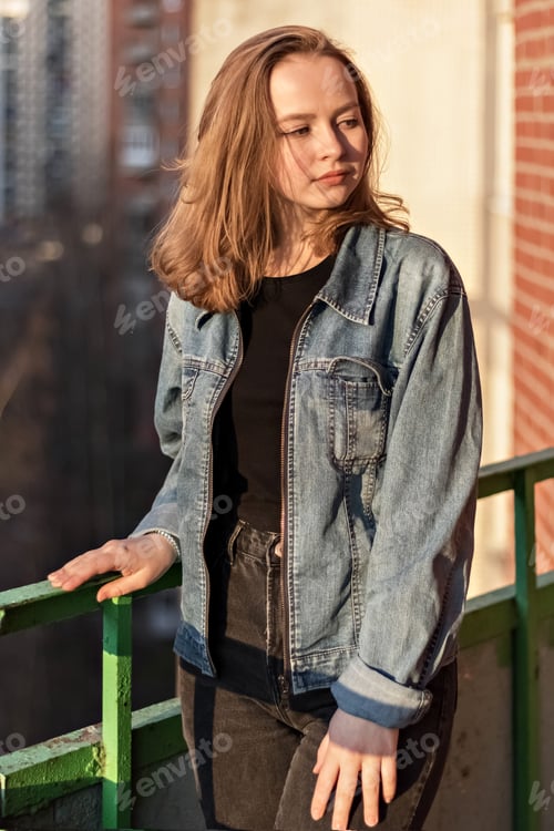 Preview: Young Woman in Denim Jacket Urban Setting