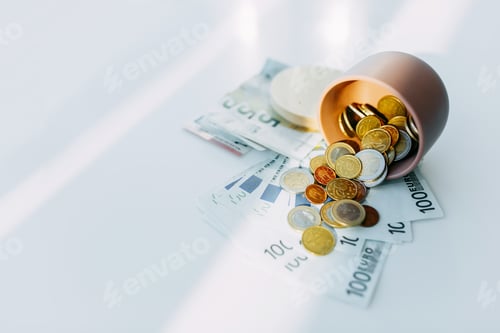 Preview: Paper currency notes and coins euros, white background