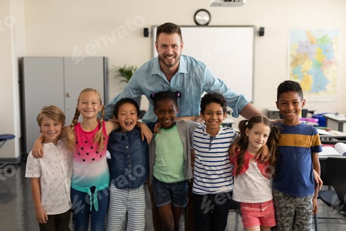 Preview: Happy school kids and teacher standing classroom