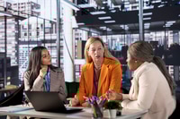 Preview: Female CEOs in a business meeting evaluating monthly statistics and records