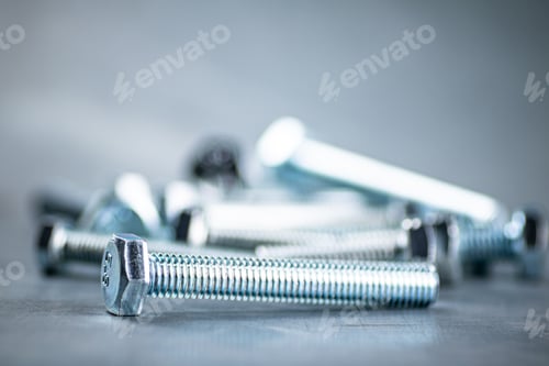 Preview: Working tool. Bolts on a gray background.