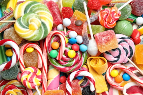 Preview: Many different yummy candies as background, top view