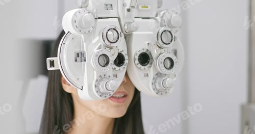 Preview: Woman having eye test