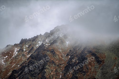 Preview: Landscape of mountain peak in low clouds.