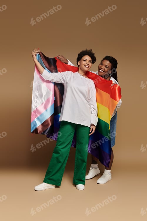Preview: Celebrating love and style with a vibrant lesbian couple holding pride flags