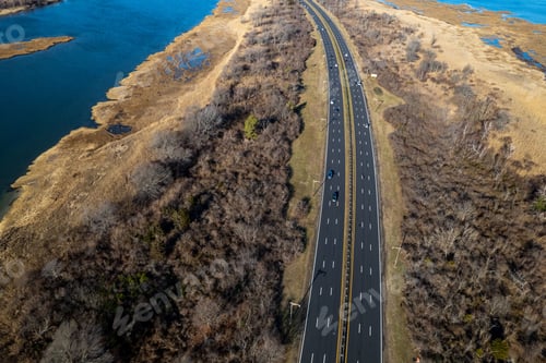 Preview: Aerial top view of cars on the highway running through a salt marsh in Long Island