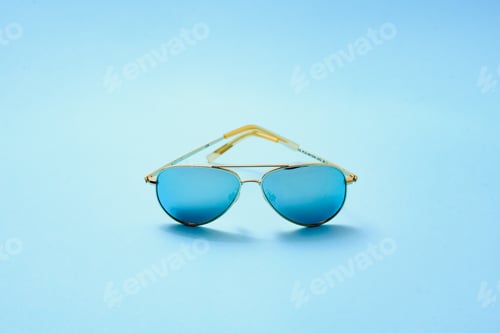 Preview: Stylish sunglasses on a blue background
