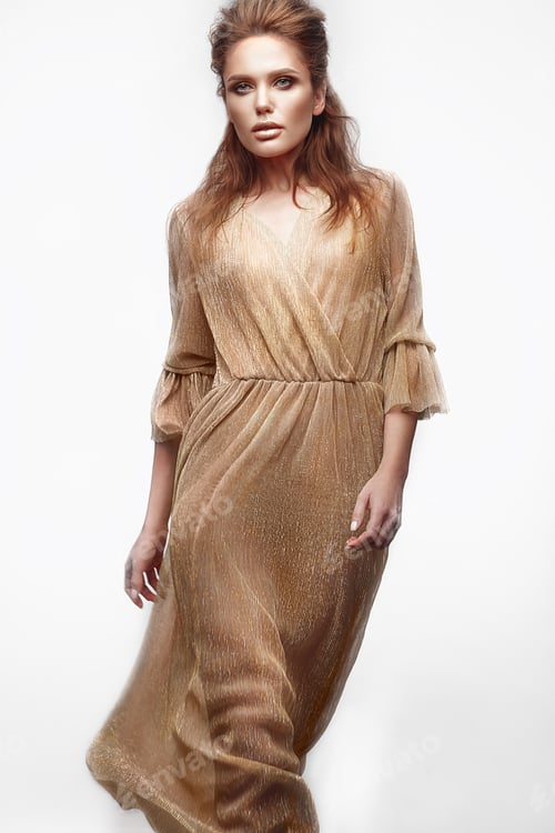 Preview: Beautiful sexy girl with sensual lips, fashion hair, gold dress and accessories. Beauty face.