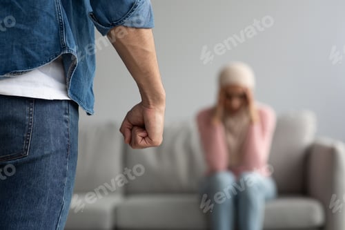 Preview: Angry man punishment fist over scared or terrified woman