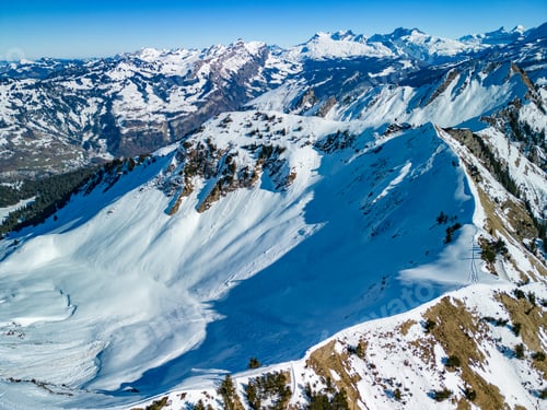 Preview: Aerial drone view of snow covered ski slopes at Stoos,Switzerland