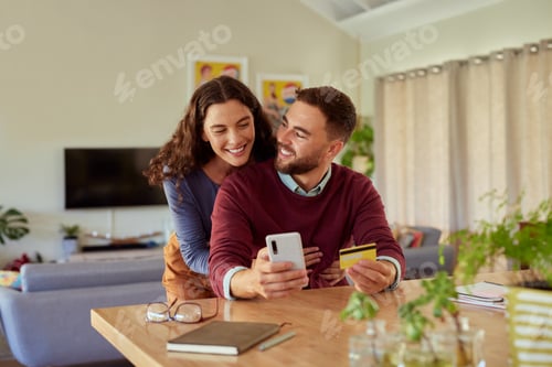 Preview: Smiling Couple Shopping Online at Home