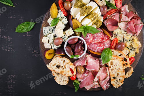 Preview: Antipasto platter with ham, prosciutto, salami, blue cheese, mozzarella with pesto