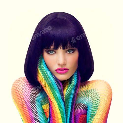 Preview: Studio shot of a beautiful young woman wearing colorful clothes and makeup