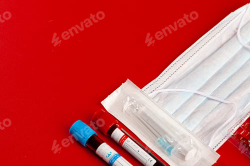 Preview: Protective mask with test tubes. Coronavirus outbreak concept