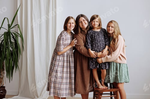 Preview: Four young girls in dresses of retro colors