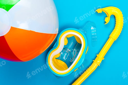 Preview: Colorful beach ball and snorkel gear ready for summer fun at the pool