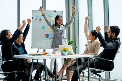 Preview: Group of Asian business man and woman raise their hands up to express happiness and celebration