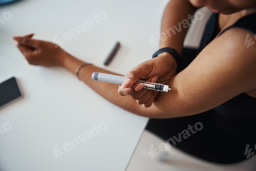 Preview: Afro American young woman doing vitamin injection