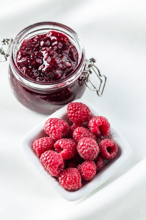 Preview: Sweet raspberry jam and raspberries.