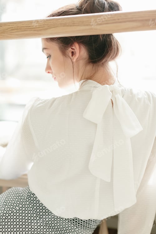 Preview: Girl student in casual outfit reading book, studying in sunny ballet dance room