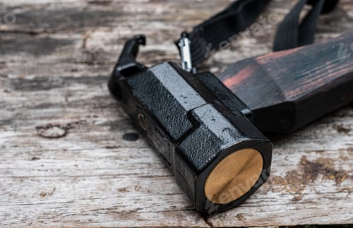 Preview: Tent peg nail iron hammer handle is made of ebony wood on old wooden background