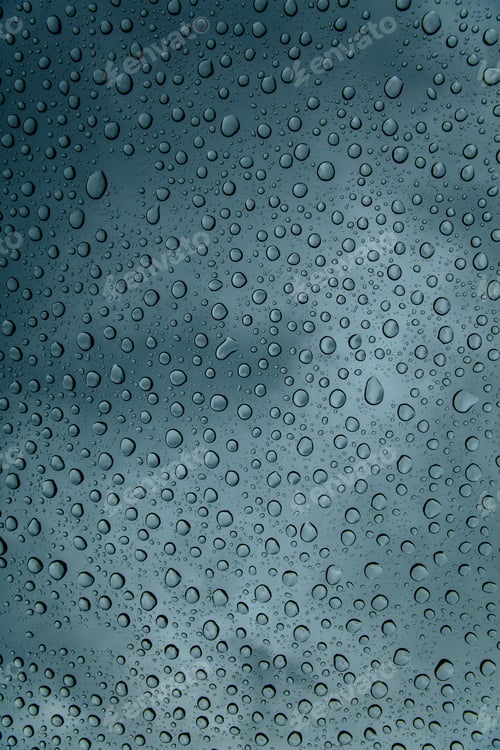Preview: Natural background of rain splash drops on window glass