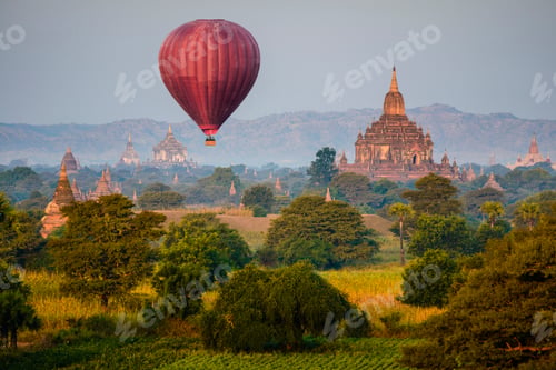 Preview: Hot air balloon flying over towers