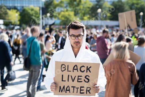 Preview: Black lives matters protesters holding signs and marching outdoors in streets