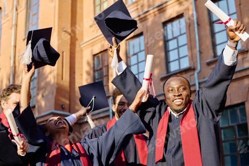 Preview: Excited multiethnic students getting diplomas
