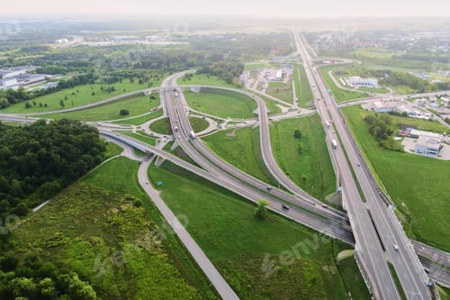 Preview: Cars moving on transport road junction in city, aerial view