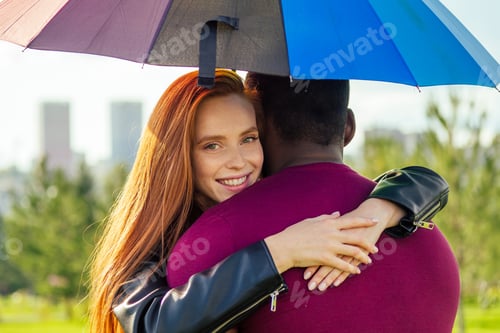 Preview: redhaired ginger woman and african american man standing close