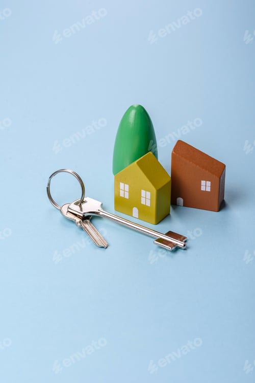 Preview: A small wooden house and keys as an idea for investing in your own home