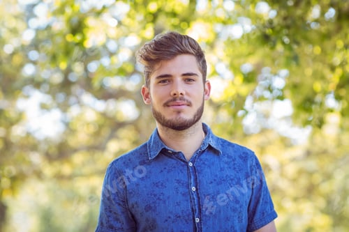 Preview: Handsome hipster looking at camera on a sunny day