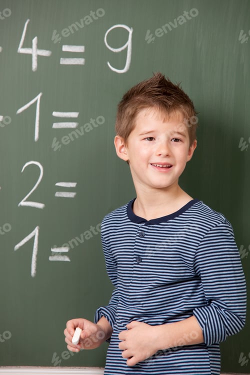 Preview: Schoolboy at blackboard with arithmetic problems