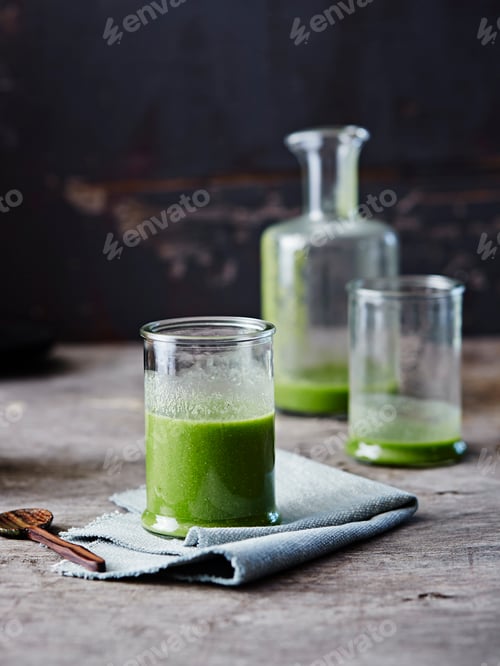 Preview: Glass of green smoothie on a rustic table
