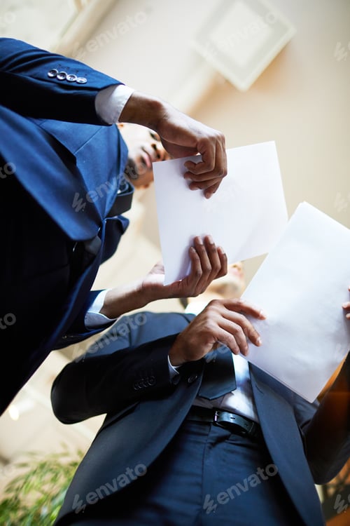 Preview: Office employees reading documents