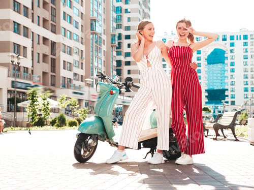 Preview: Two young beautiful woman posing outdoors