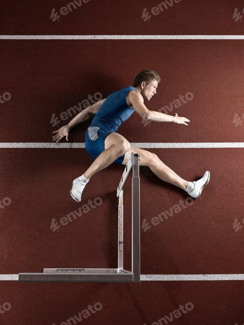 Preview: Runner laying with hurdle on track