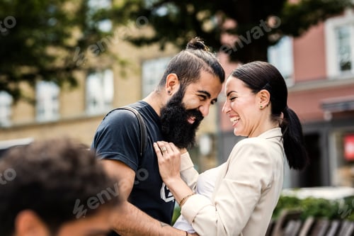 Preview: Happy couple outdoors laughing