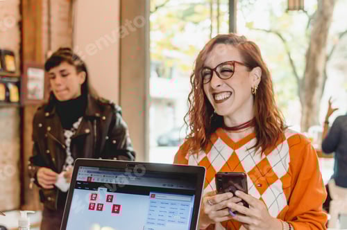 Preview: young woman at a restaurant checkout smiling ordering food