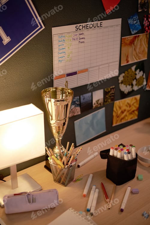 Preview: Organized Desk with Trophy and Study Schedule Displayed