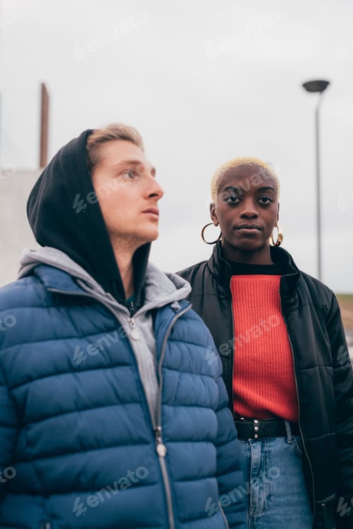 Preview: Two friends gazing into the distance on an overcast day