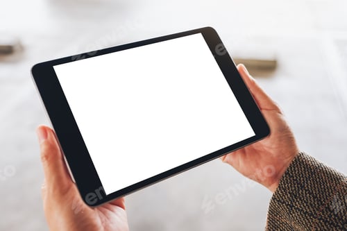 Preview: Mockup image of a woman holding black tablet pc with blank white screen on the street