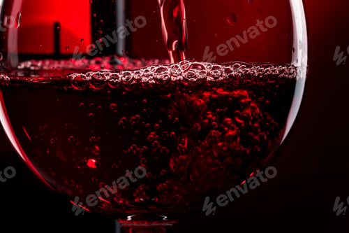 Preview: Red wine on red black background, abstract splashing. Macro shot