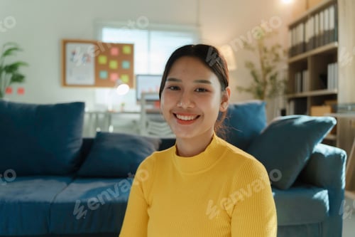 Preview: Young Asian Freelancer Woman Smiling and Working From Home