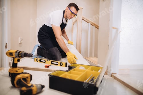 Preview: Maintenance man fixing a new floor