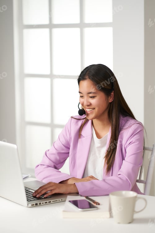 Preview: young attractive asian woman who works as an operator